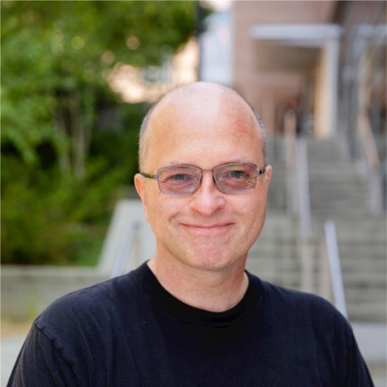 man in polarized glasses smiling at camera